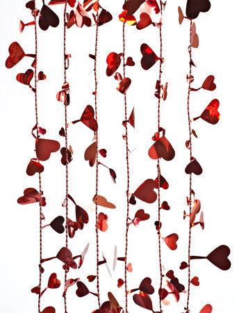 On a white background with a vertical wire heart shape.の写真素材