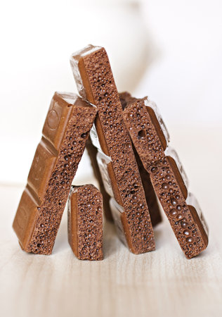 Chocolate chips on the table, put the vertical.の写真素材