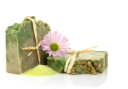 Natural handmade soap and pink flower on a white background.の写真素材