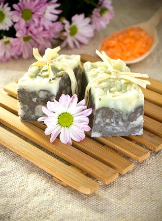 Natural soap, handmade. Pink flowers and spoon with sea salt.の写真素材
