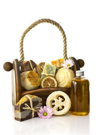 Composition of the basket full of handmade soap, isolated on white background.の写真素材