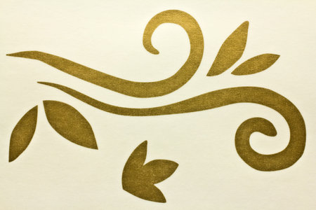 Gold ornament on a light background, studio photography.の写真素材