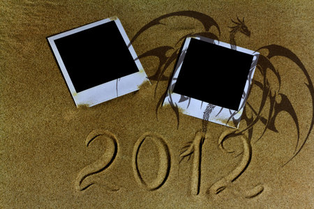 The sand polaroid photos of dragon picture and the inscription in 2012 year.の写真素材