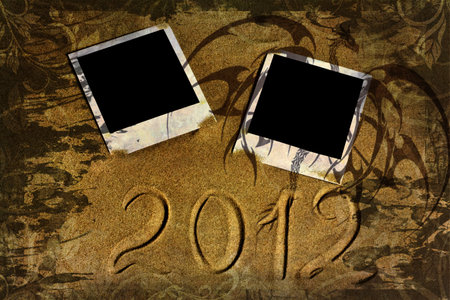 Polaroid photos and dragon pattern on old grunge background. Happy 2012 year.の写真素材