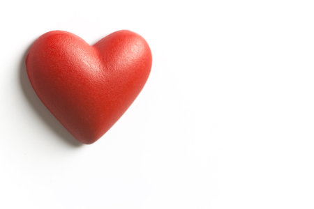 Red wood texture heart isolated on white. の写真素材