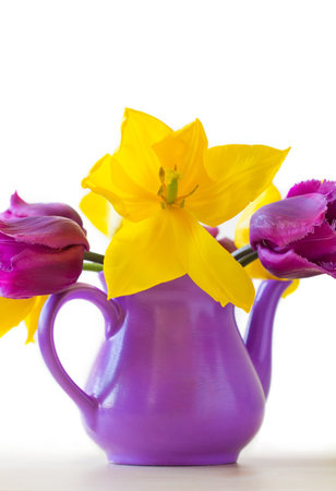 Purple and yellow tulips, ceramic vase の写真素材