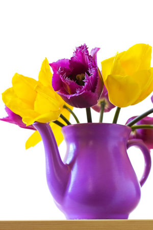 Purple and yellow tulips, ceramic vase の写真素材
