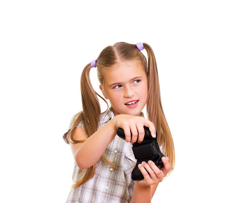 A teenaged girl playing video game  Isolated on white background の写真素材