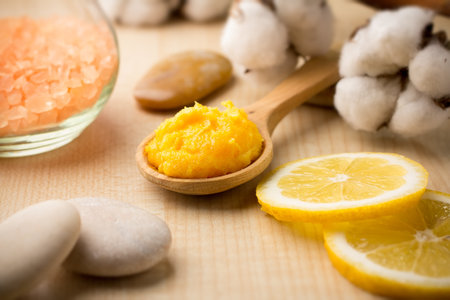 Mango body butter, spa stones and lemon.の写真素材