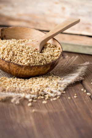 Soy wooden bowl on a wooden surface, eco product.の写真素材
