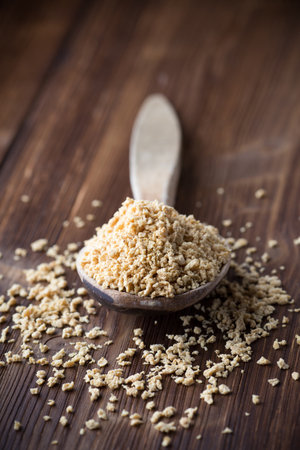 Soy wooden bowl on a wooden surface, eco product.の写真素材