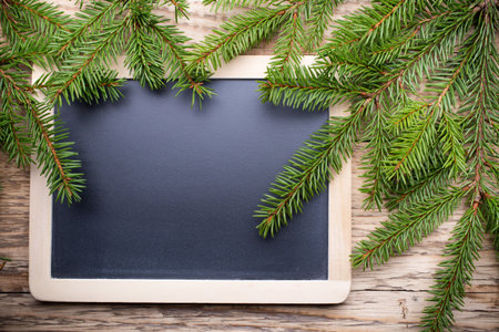 Christmas menu blackboard and wooden background.の写真素材