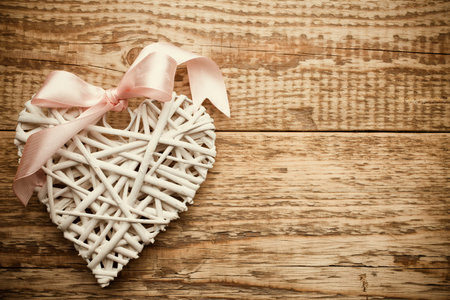 White heart and wooden  background.の写真素材