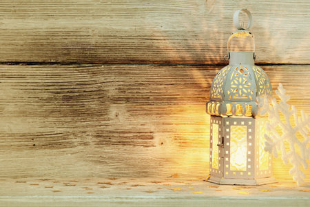 Lantern, Christmas decor, wooden background.の写真素材