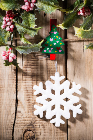 Christmas ornament At the wooden board with pegs pinnedの写真素材