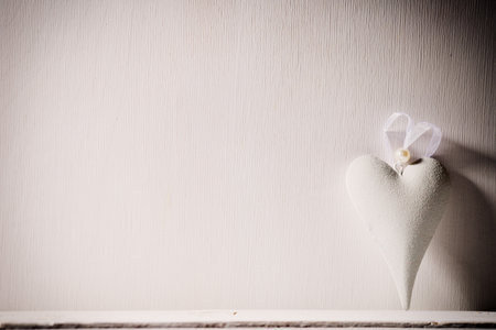 Heart on a wooden background. Vintage style.
