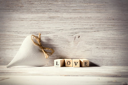 Heart on a wooden background. Vintage style.の写真素材