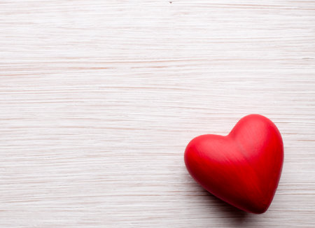 Heart on a wooden background. Vintage style.の写真素材
