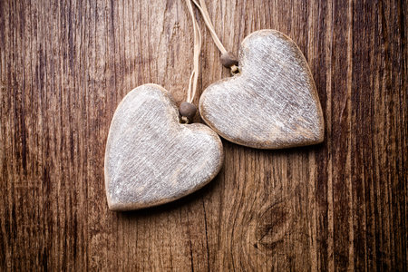 Heart on a wooden background. Vintage style.の写真素材