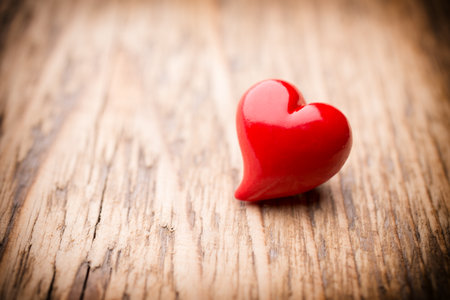 Heart on a wooden background. Vintage style.の写真素材