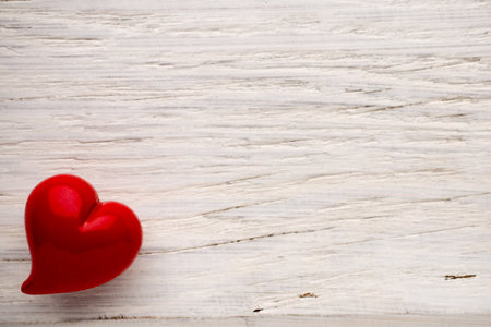 Heart on a wooden background. Vintage style.の写真素材