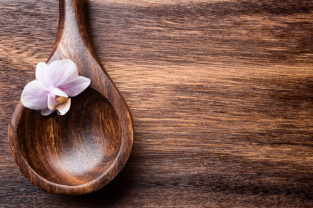 Sea salt wooden spoon on brown wooden background.の写真素材