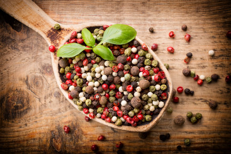 Spice mix a wooden spoon on a wooden background.の写真素材