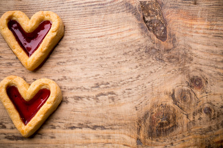 Heart-shaped cookies on a wooden background. Studio picture.の写真素材