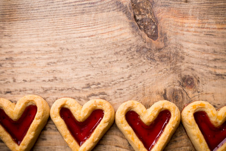Heart-shaped cookies on a wooden background. Studio picture.の写真素材