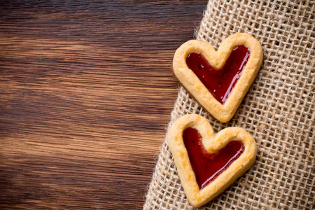 Heart-shaped cookies on a wooden background. Studio picture.の写真素材