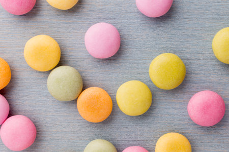 Small round candy-colored pastels on pastel background.
