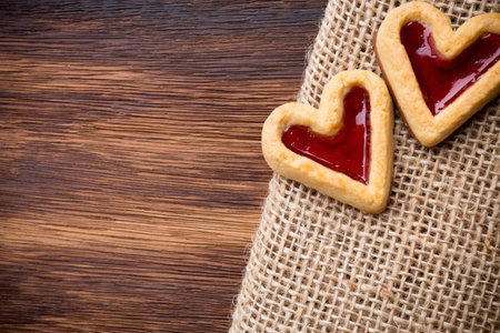 Heart-shaped cookies on a wooden background. Studio picture.の写真素材