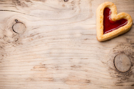 Heart-shaped cookies on a wooden background. Studio picture.の写真素材