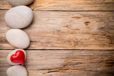 Red heart on a wooden background. studio photography.の写真素材
