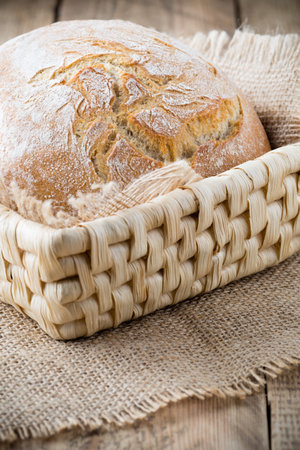 Fresh  bread on a wooden background. Studio photography.の写真素材