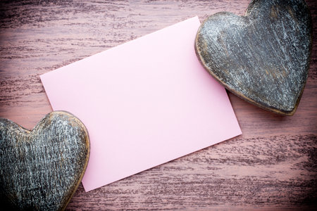 Valentine's Day greeting card. Heart on a wooden background.の写真素材