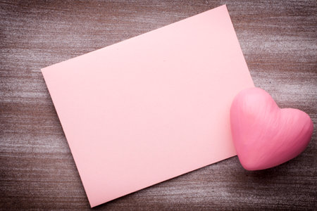 Valentine's Day greeting card. Heart on a wooden background.の写真素材