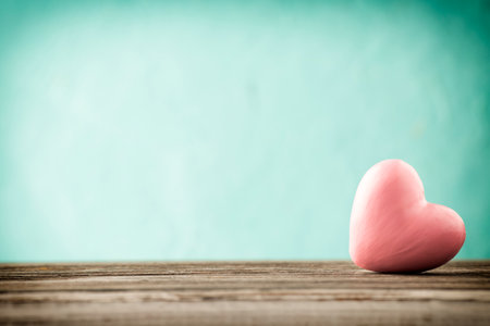 Hearton the wooden background. Valentines day greeting card.の写真素材