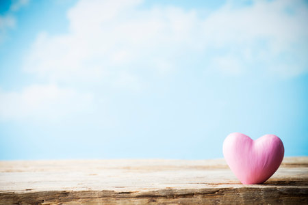 Heart on a wooden board. Valentine's Day greeting card.の写真素材