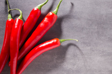 Chilli pepper on the grey background.