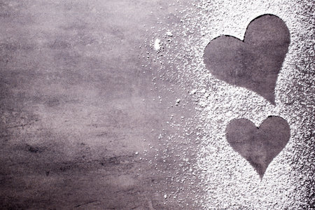 On the gray surface of the heart shape.の写真素材