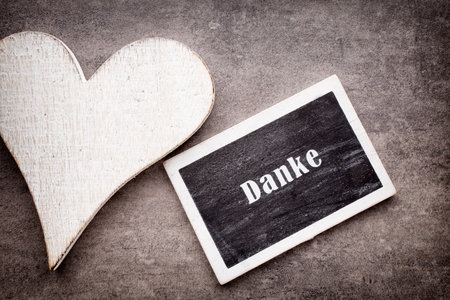 Valentine's Day greeting card. Heart on a wooden background.の写真素材