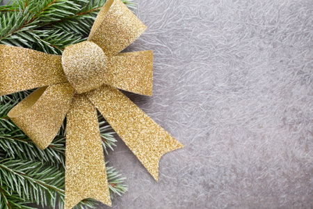 Spruce branch with Christmas decorations on a gray background.の写真素材