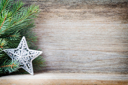 Christmas decoration with fir branches on the wood background.の写真素材