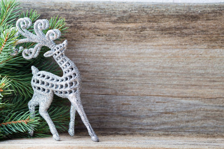 Christmas decoration with fir branches on the wood background.の写真素材