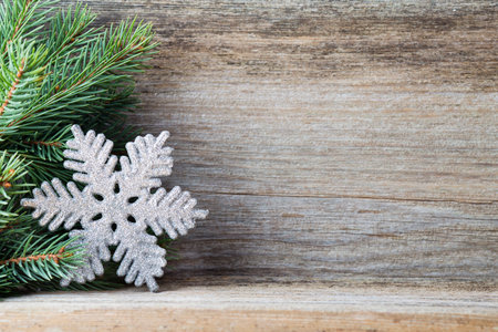 Christmas decoration with fir branches on the wood background.の写真素材