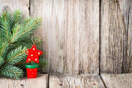 Christmas decoration with fir branches on the wood background.の写真素材