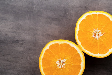 Orange slice on the grey  background.