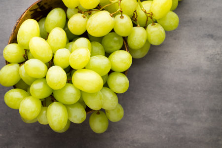 Grape cluster on the grey background.の写真素材