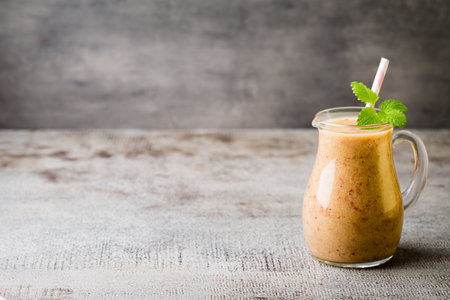 Grape smoothie, on the grey  background.の写真素材